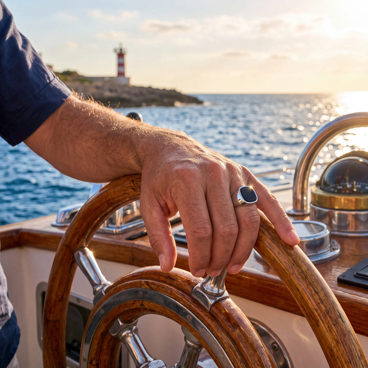 Black stone signet ring, silver, worn on a boat